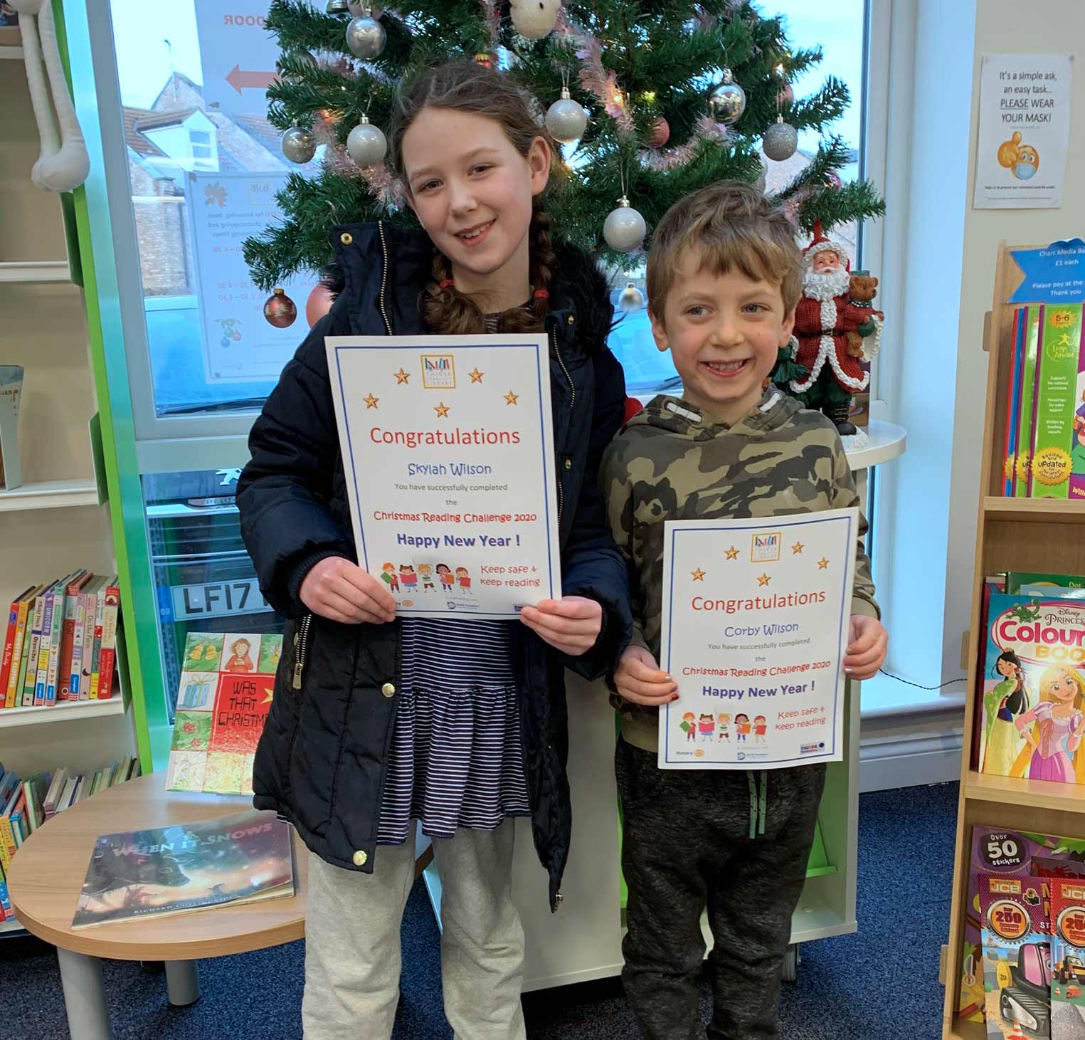 Skyler and Corby Wilson receiving their reading challenge certificates