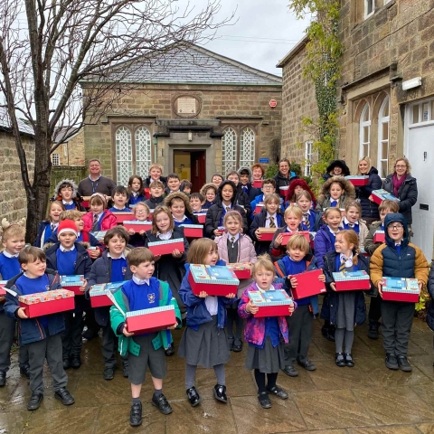 Children from Ripley Endowed School with their gift boxes