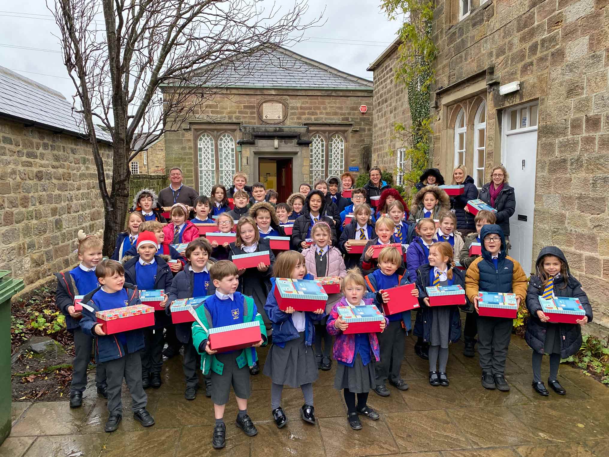 Children from Ripley Endowed School with their gift boxes