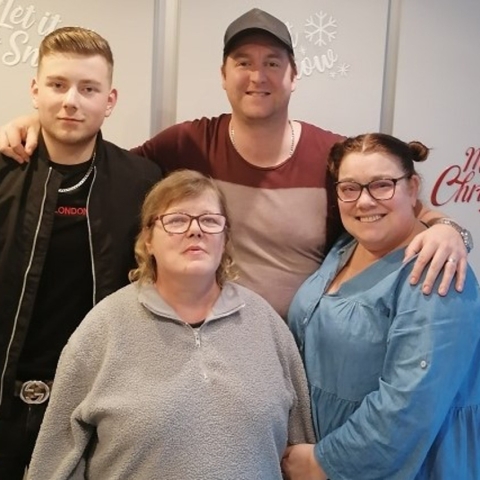Sarah Cattell and her husband Adam with the people they support through Shared Lives