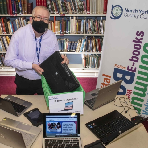 Mark Glossop from Scarborough library with dropped-off lap-tops and the Reboot North Yorkshire website
