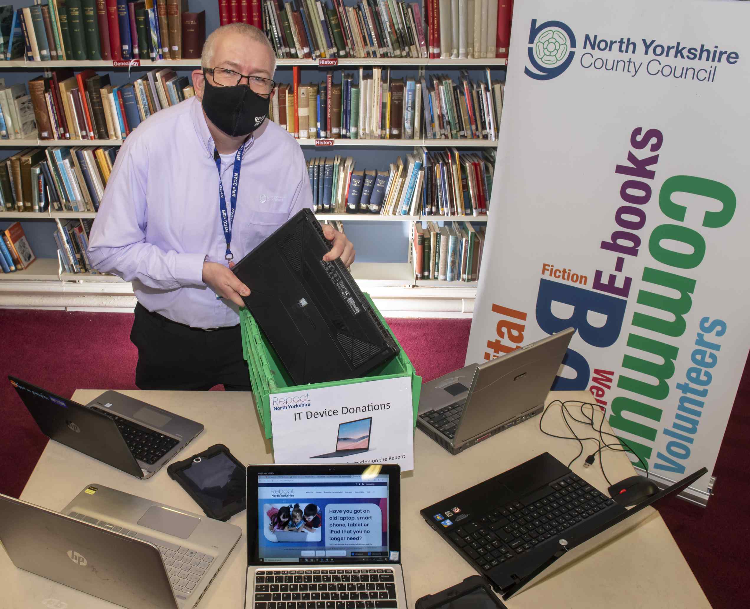 Mark Glossop from Scarborough library with dropped-off lap-tops and the Reboot North Yorkshire website