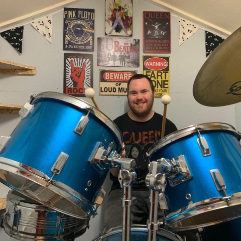 Joe Husband, a student at Henshaws Specialist College, is an avid Queen fan and has his own drumkit to practice his beats at home