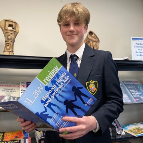 Tom Cave has won a coveted prize in a prestigious University of Oxford competition which attracted entries from all over the world.