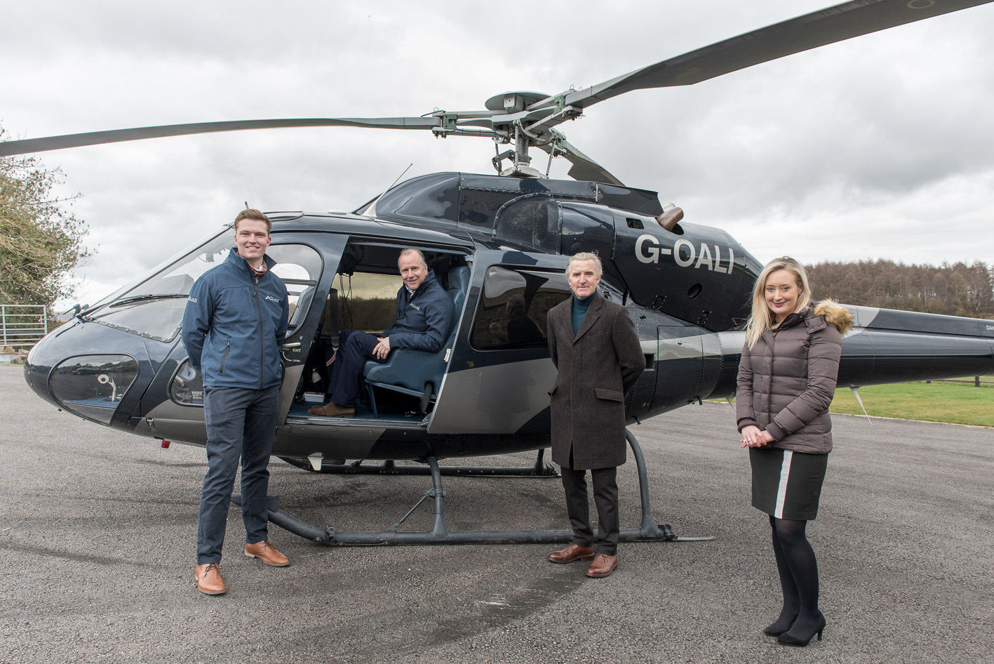 Celebrating the successful acquisition of Atlas Helicopters are, from left, Jack Schofield, Jason Schofield, James Towler and Emily Steed