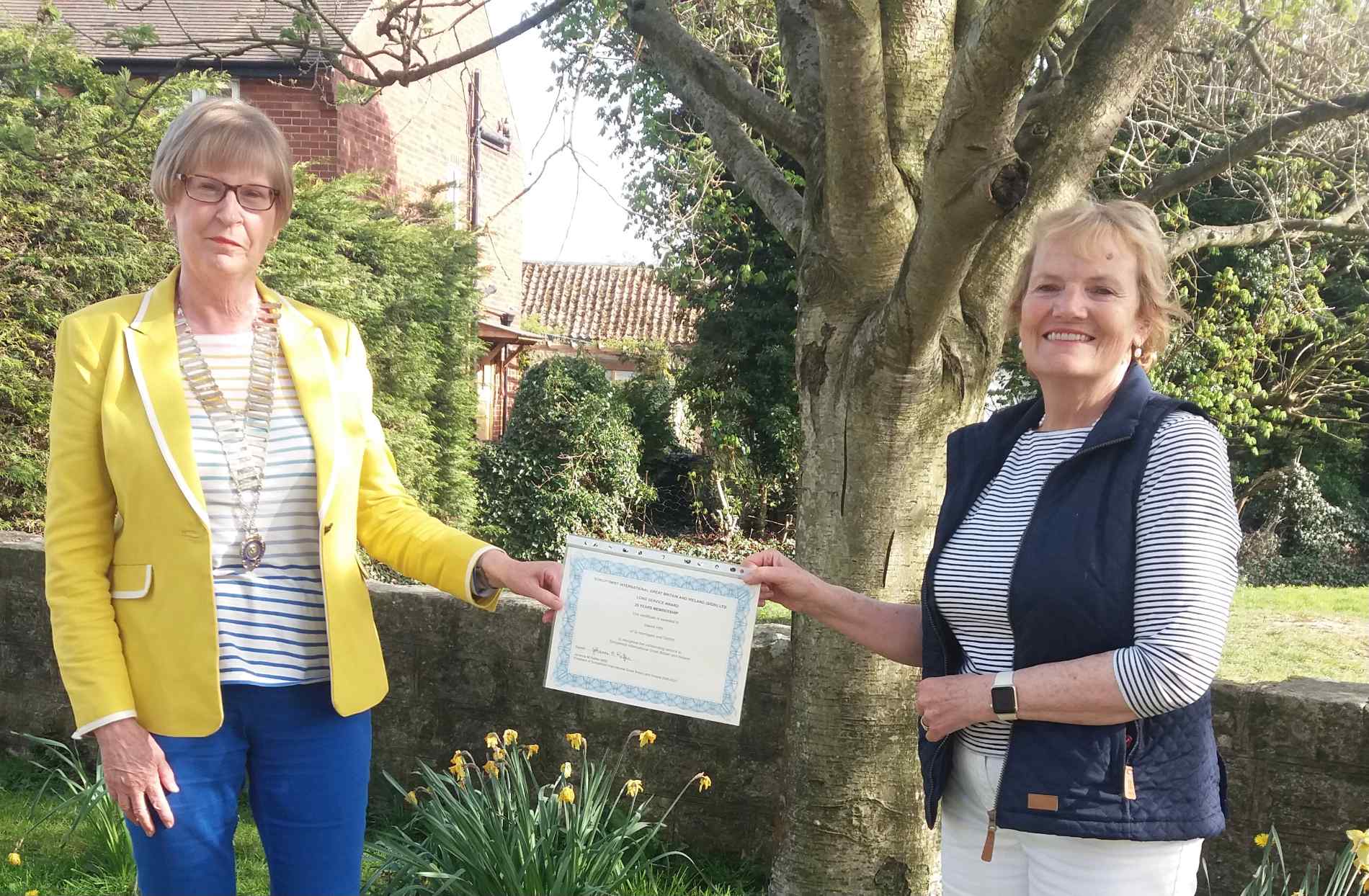 Dorothy Taylor receives long service certificate from President Sandra Frier