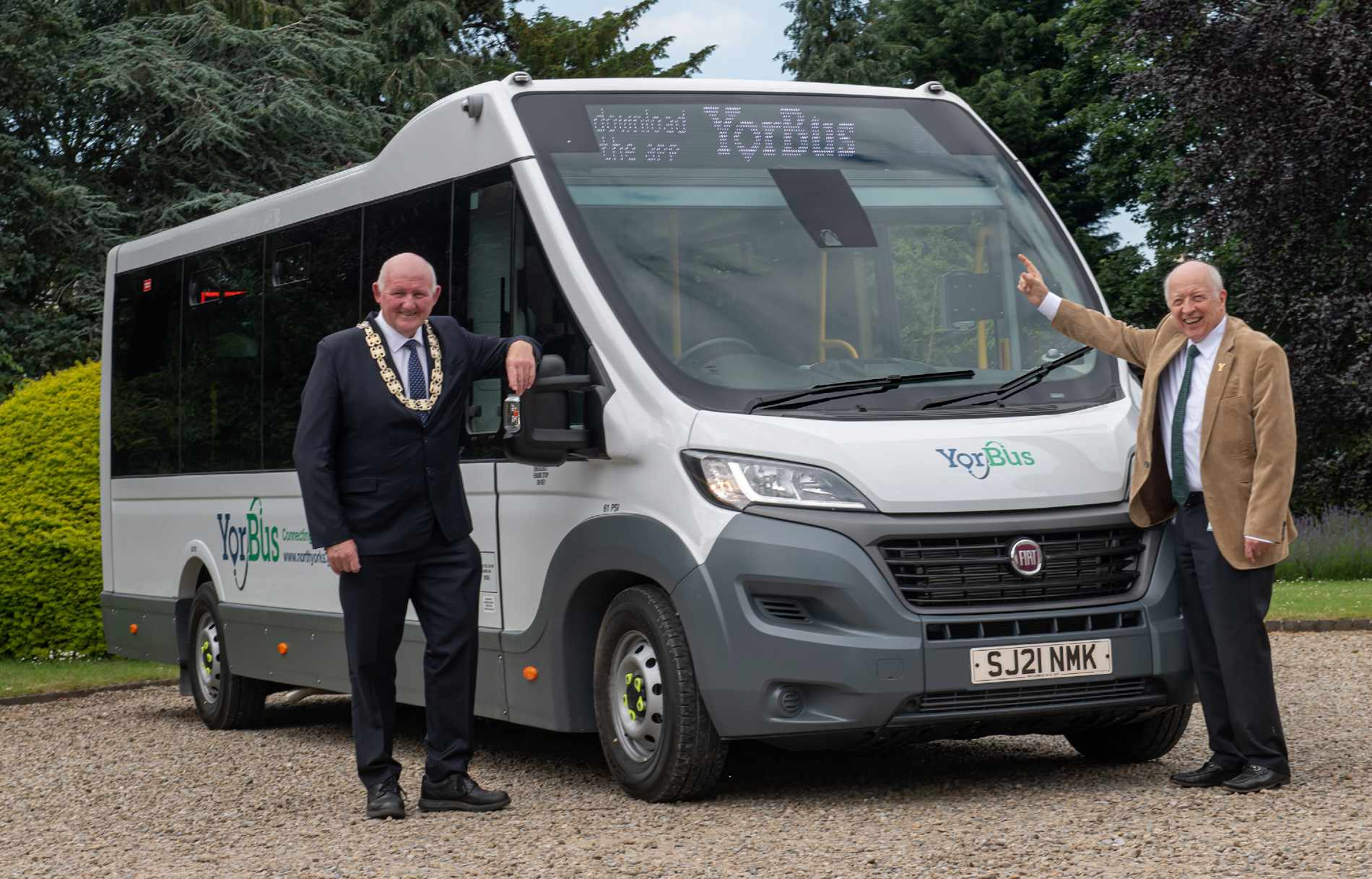 County Council Chairman Councillor Stuart Martin (left) and Leader Councillor Carl Les in front of the new bus