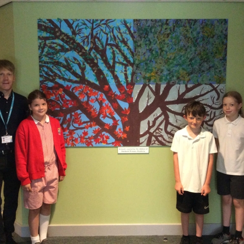 head teacher Garry de Castro-Morland with children from Starbeck Primary Academy