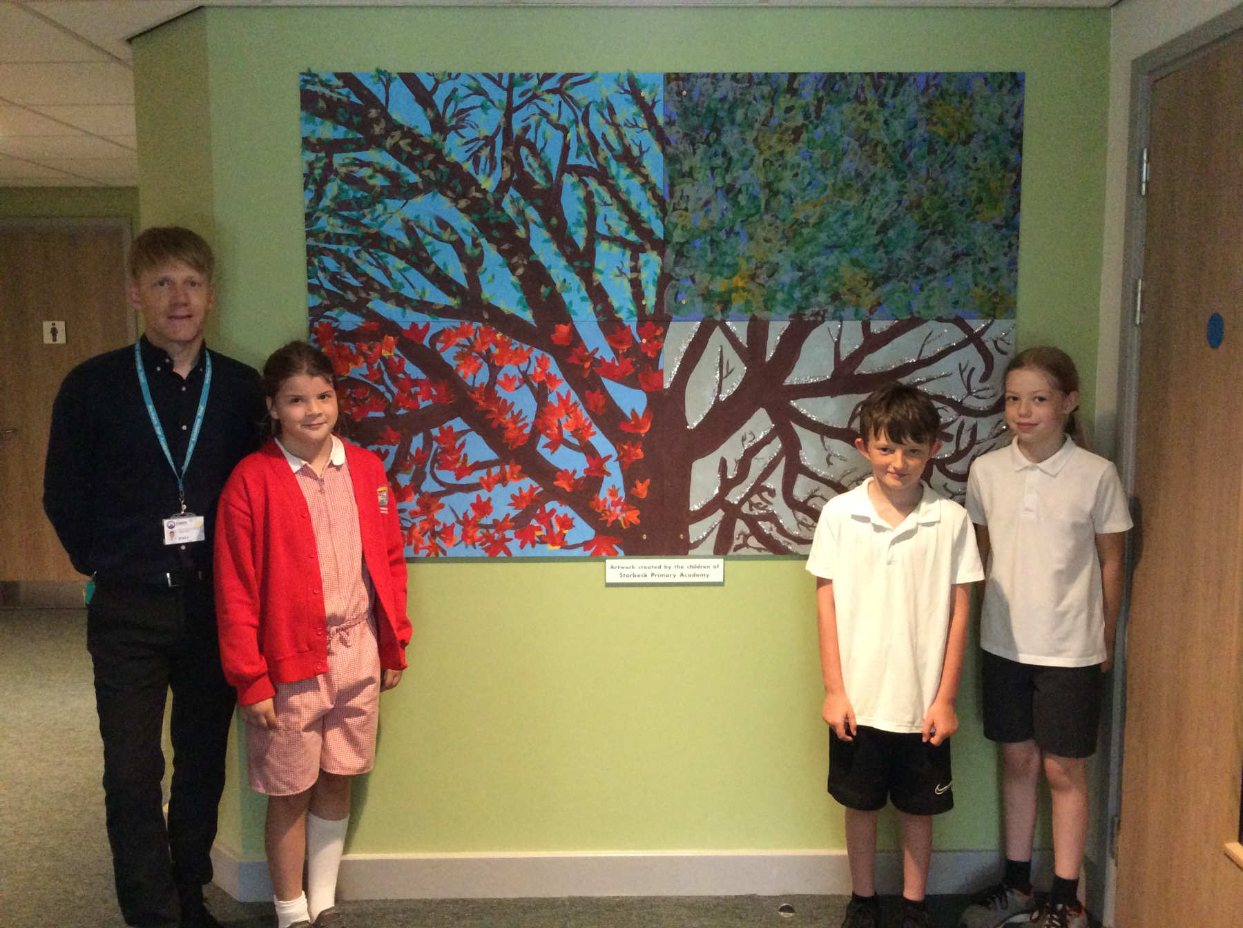 head teacher Garry de Castro-Morland with children from Starbeck Primary Academy