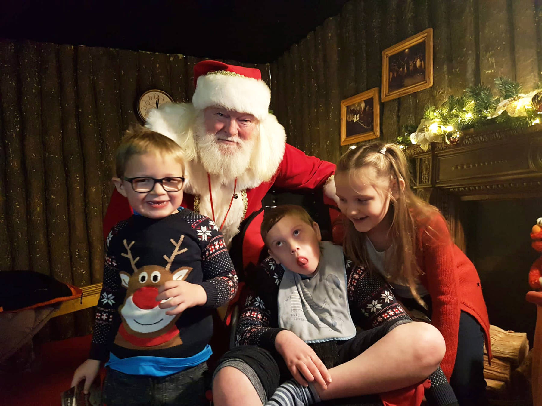 Jack Mangan with his brother Josh and sister Georgia, meeting Santa Claus