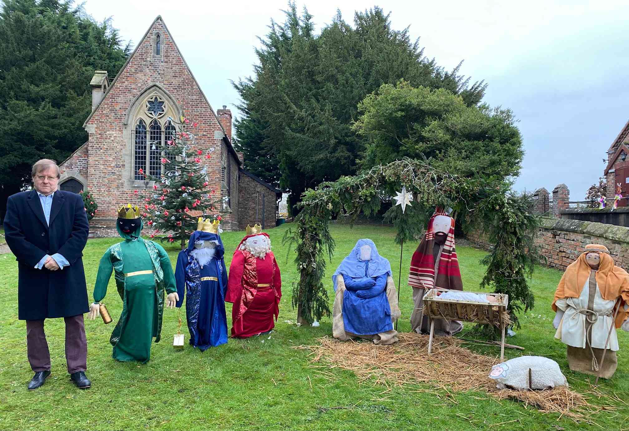 Churchwarden at St John’s, Minskip, Robert Beaumont, with the restored nativity scene