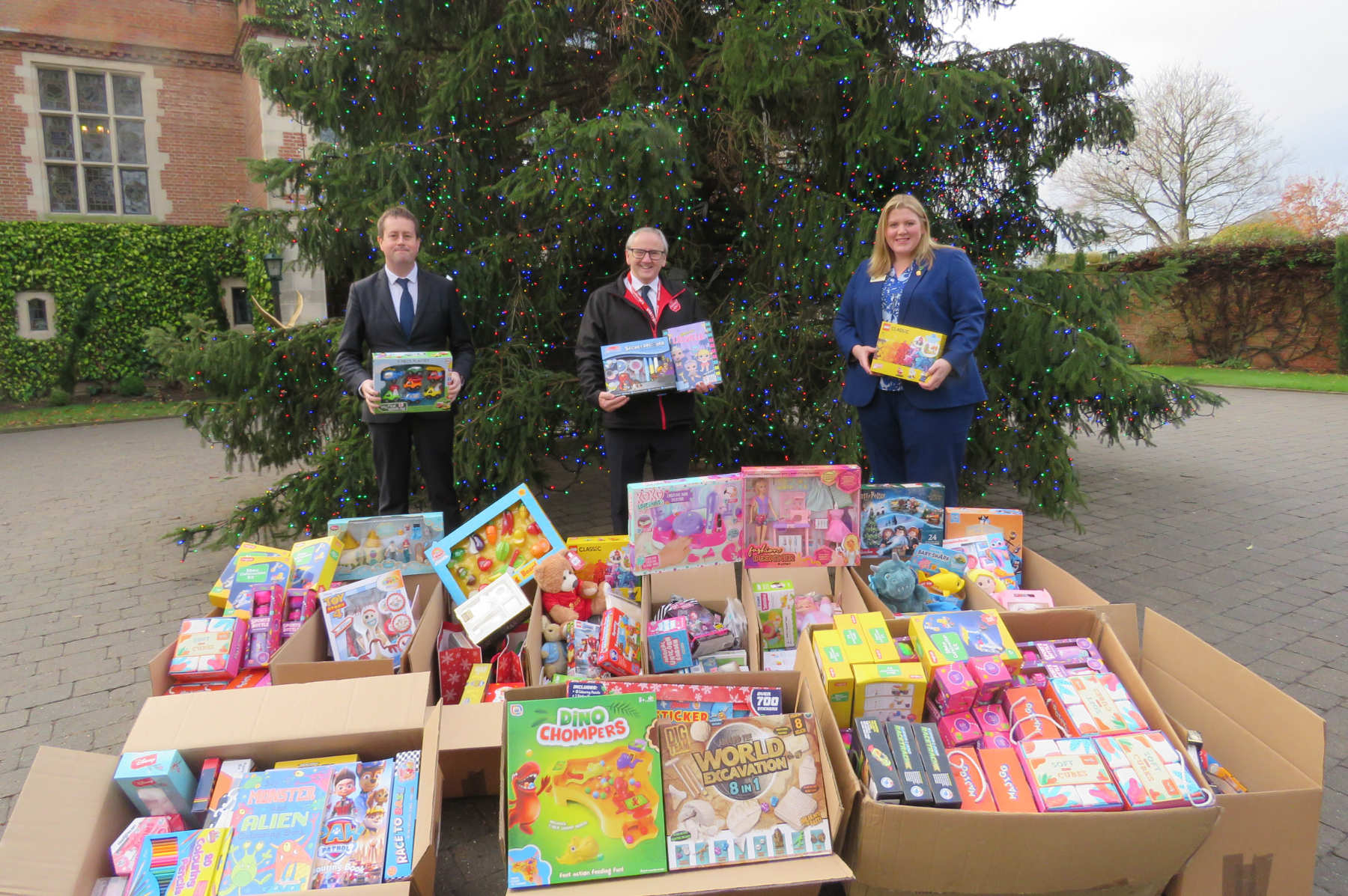(From L-R) Principal of Queen Ethelburga’s Collegiate Dan Machin, Major Andrew Dunkinson of the York Salvation Army Corps and Amy Martin, Chair of the Board at QE, with the gifts collected by the QE Community for the 2021 Christmas Present Appeal