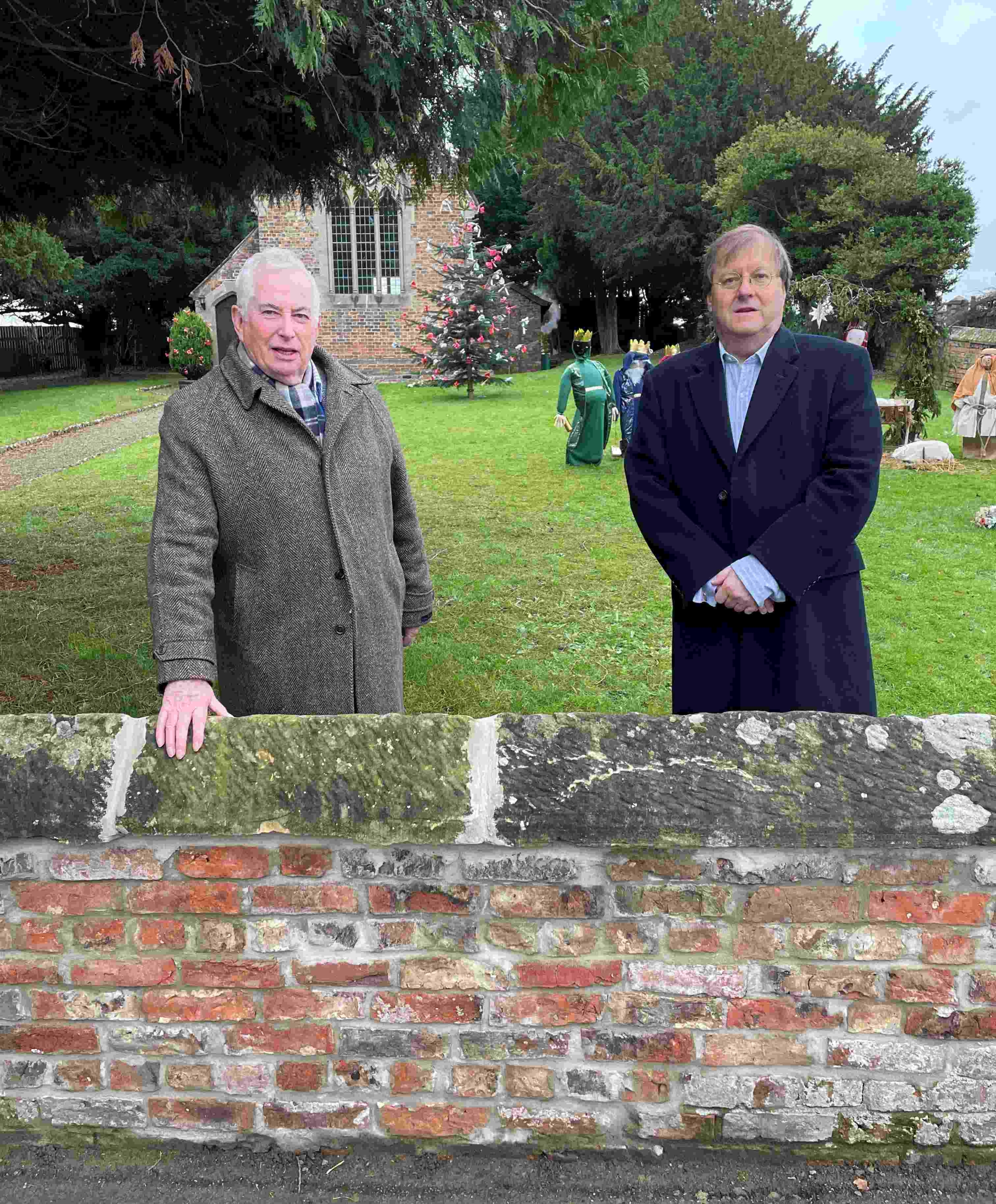 Churchwarden at St John’s, Minskip, Robert Beaumont, right, with David Armitage of York Handmade by the lovingly restored church wall