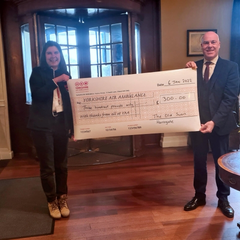 David Ritson, General Manager at The Old Swan, presents the cheque to Clare Deacon, North Yorkshire Community Fundraiser at Yorkshire Air Ambulance