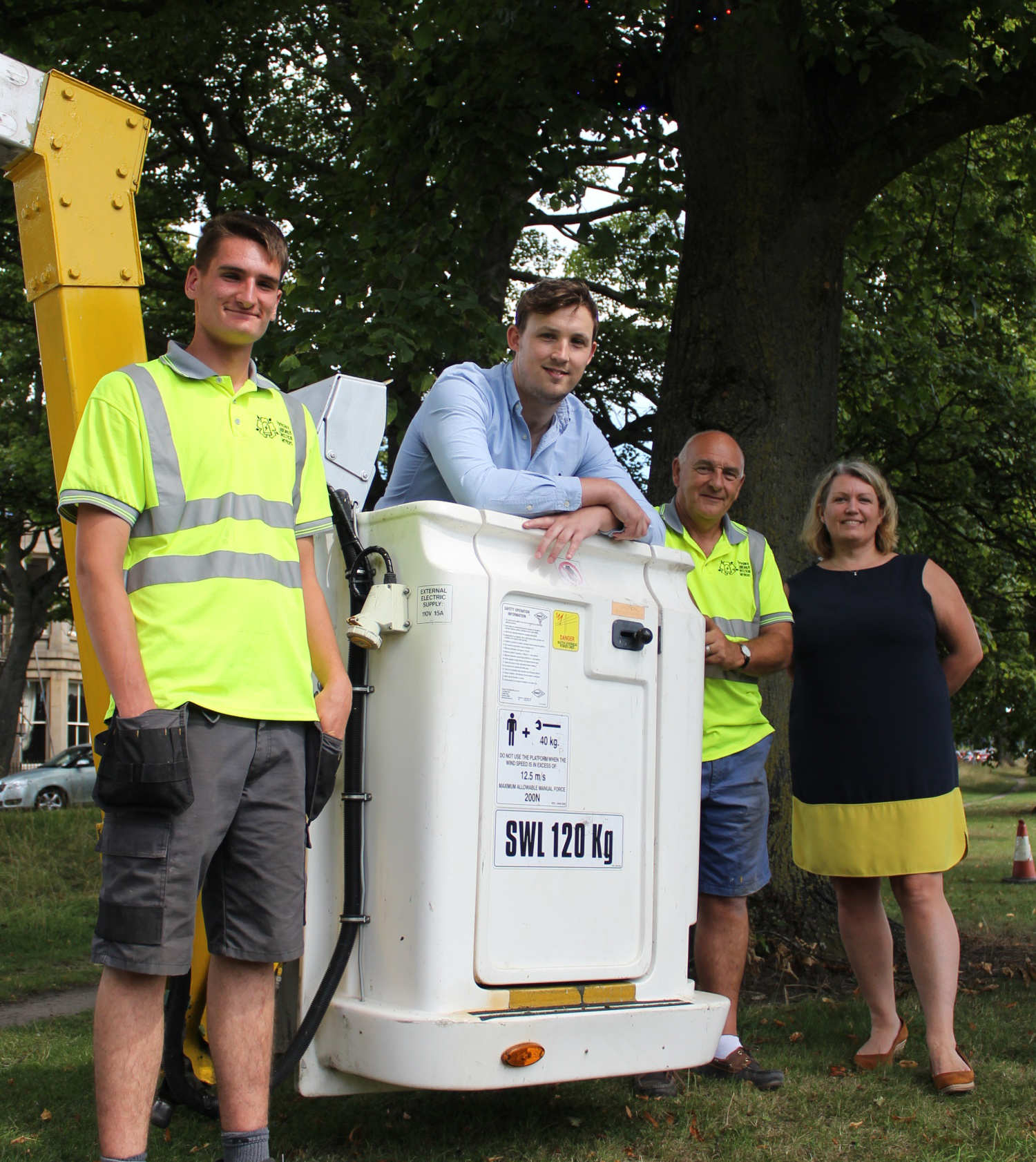 Councillor Sam Gibbs and head of parks and environmental services Alison Wilson with Yorkshire Lighting and Electrical Services