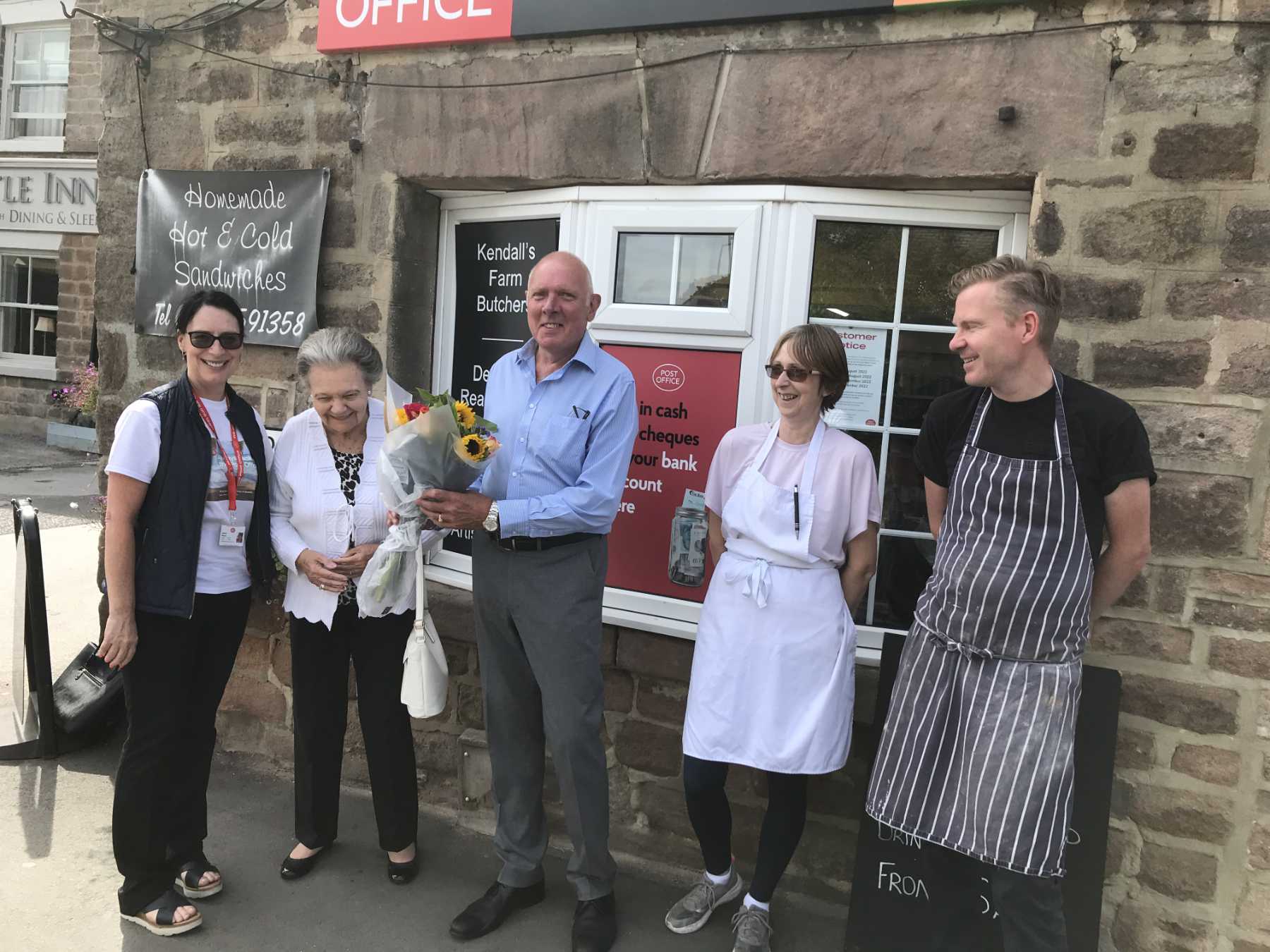 Tim Dee with other staff, with local councillor Shirley Fawcett and Post Office Area Manager Dawn Pentry (left)