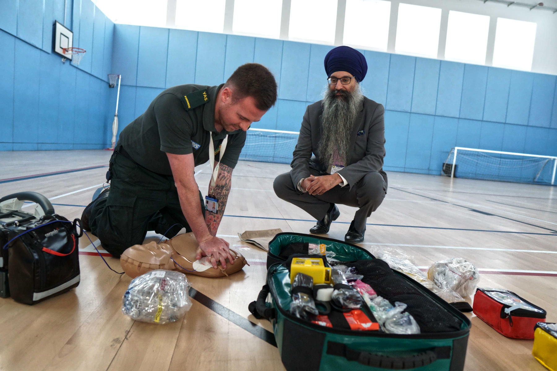 Sukhraj Gill, Head of Academy, Harrogate High School with Sean Dooley from the Yorkshire Ambulance Service