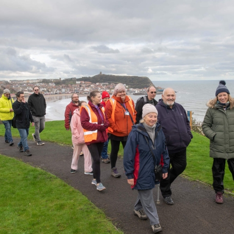 Carers Plus Yorkshire community engagement advisor Sarah Cockburn (front right) with Stuart Wilson, Paul Connor and fellow Stepping Out members on a respite walk in Scarborough