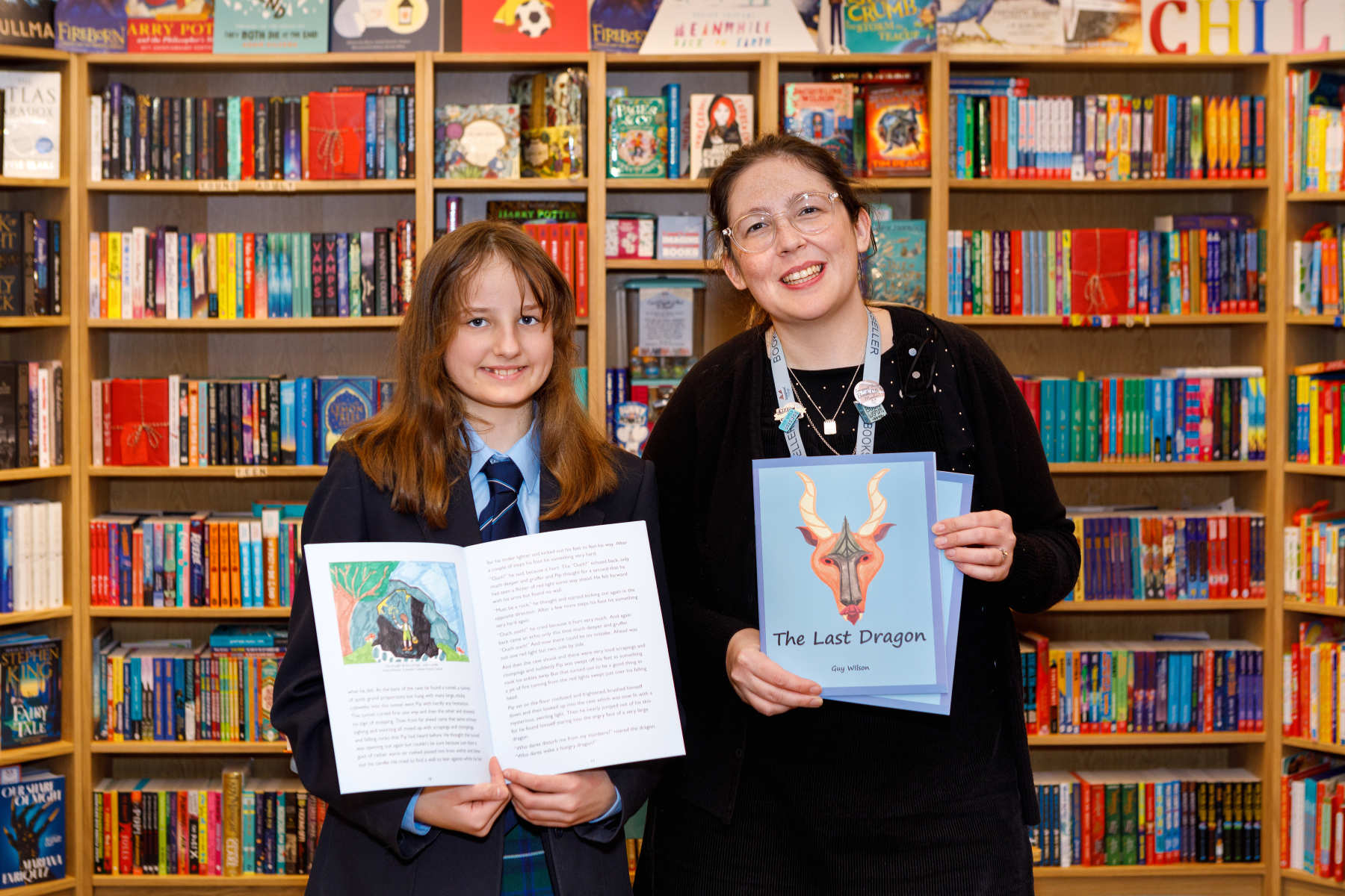 Nadia and Georgina Eckert, owner of Imagined Things Bookshop, with the newly-published book The Last Dragon