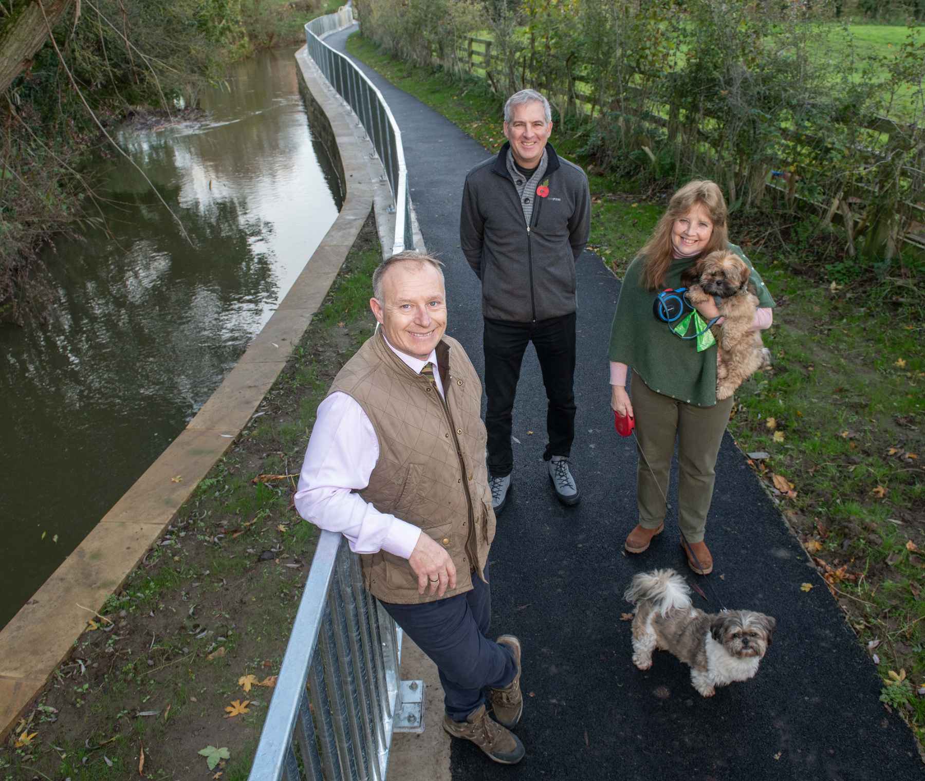 Cllr Gareth Dadd, Mayor of Thirsk, Cllr David Jackson, and resident Wendy Gibson-Brown with dogs Molly and Bodie