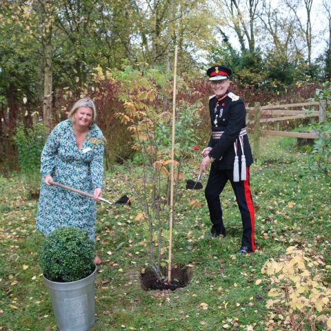 Clair Holdsworth, chief executive of Martin House, and Ed Anderson CBE, Lord-Lieutenant of West Yorkshire, plant the Queen’s jubilee tree in the grounds of Martin House