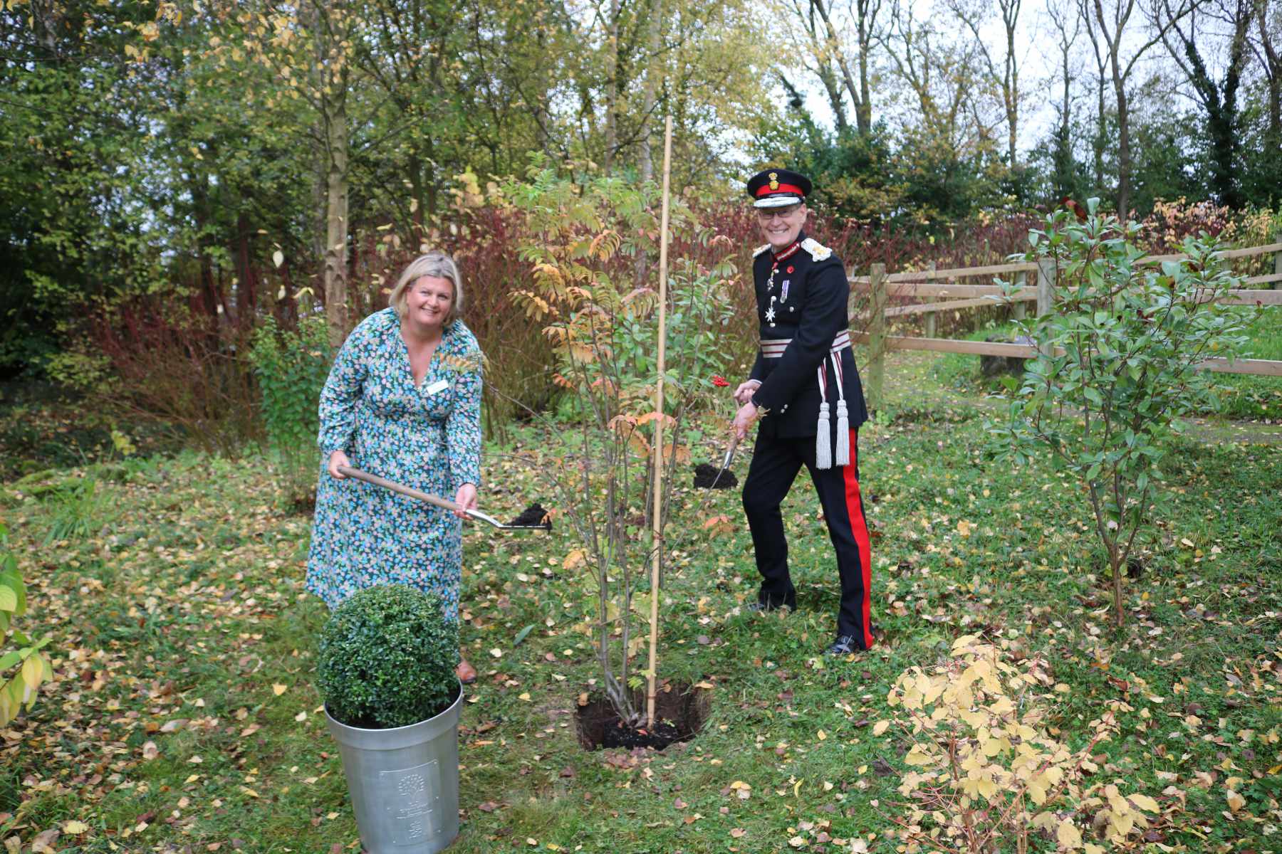 Clair Holdsworth, chief executive of Martin House, and Ed Anderson CBE, Lord-Lieutenant of West Yorkshire, plant the Queen’s jubilee tree in the grounds of Martin House