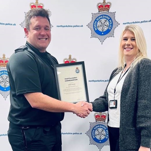 Jordan Conway receives her award from Chief Inspector Alex Langley
