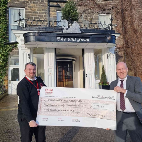 David Ritson General Manager at The Old Swan, presents a cheque for £493.87 to Jonathan Heeley, Regional Fundraiser at Yorkshire Air Ambulance