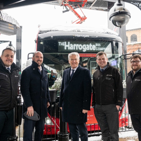 Buses Minister Richard Holden (second left) in wintry weather at Harrogate Bus Station with (from left) Transdev Operations Director Vitto Pizzuti; Harrogate and Knaresborough MP Andrew Jones; Transdev Commercial Manager Matt Burley; and Network Manager Alex Spencer