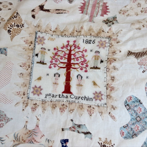 A Detail of an Unusual Early 19th Century Cotton Coverlet, centred with a sampler worked by Martha Curchin