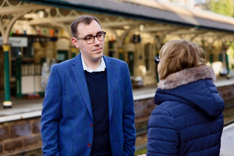 Tom Gordon talking with a Knaresborough resident at the station