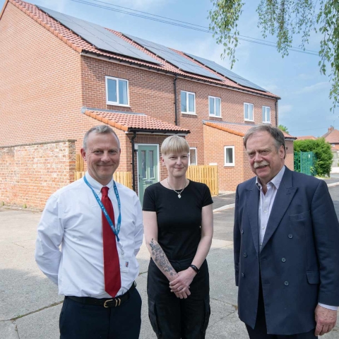 North Yorkshire Council’s executive member for housing, Cllr Simon Myers (right), Clare Edwards and North Yorkshire Council’s head of housing, Andrew Rowe, outside the new homes in Ripon