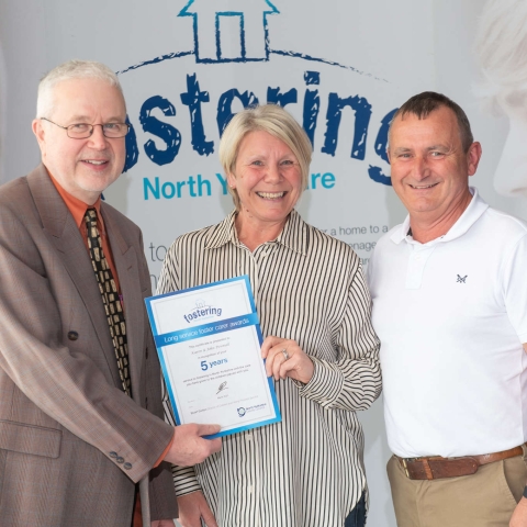 Foster carers John and Karen Pownall with North Yorkshire Council’s placement and fostering manager, Alan Tucker, at an annual conference earlier this year after being recognised for the rewarding work they do
