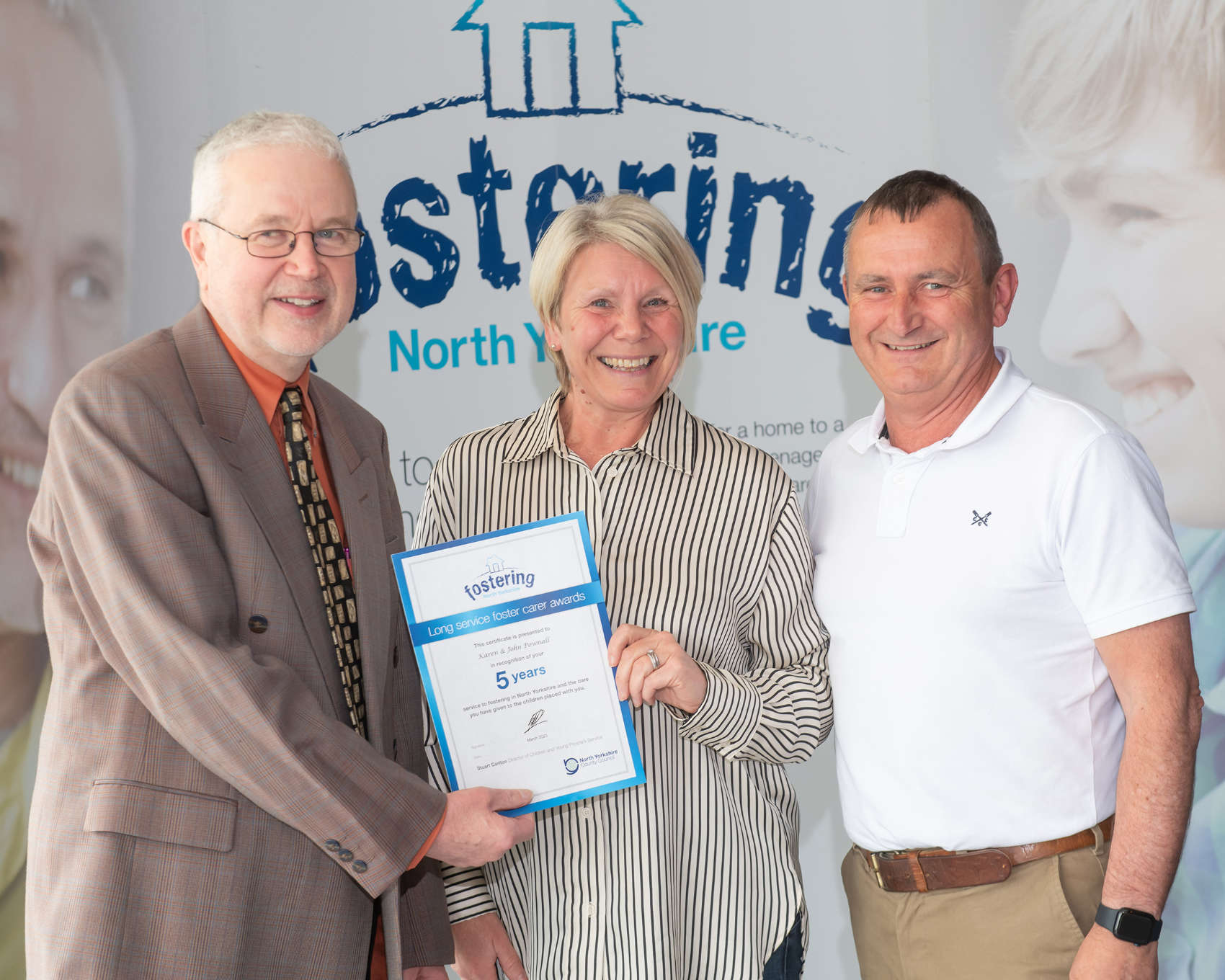 Foster carers John and Karen Pownall with North Yorkshire Council’s placement and fostering manager, Alan Tucker, at an annual conference earlier this year after being recognised for the rewarding work they do