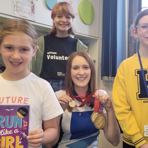 North Yorkshire-based Paralympian and author Danielle Brown with her gold medals and an honorary Ready, Set, Read medal. Danielle visited Skipton library to talk about how she overcame disability, nerves and lack of confidence to become an Olympic champion in Beijing and London. With Danielle are two of Skipton library’s young volunteer Reading Hacks, Beth Kent, 12, and Emily Scott, 16, while Summer Reading Challenge participant Lucy Browne, seven, holds Danielle's book, Run Like a Girl
