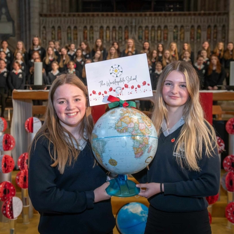 Wensleydale School students Millie Gilbey and Jessica Arnott with their school’s globe.