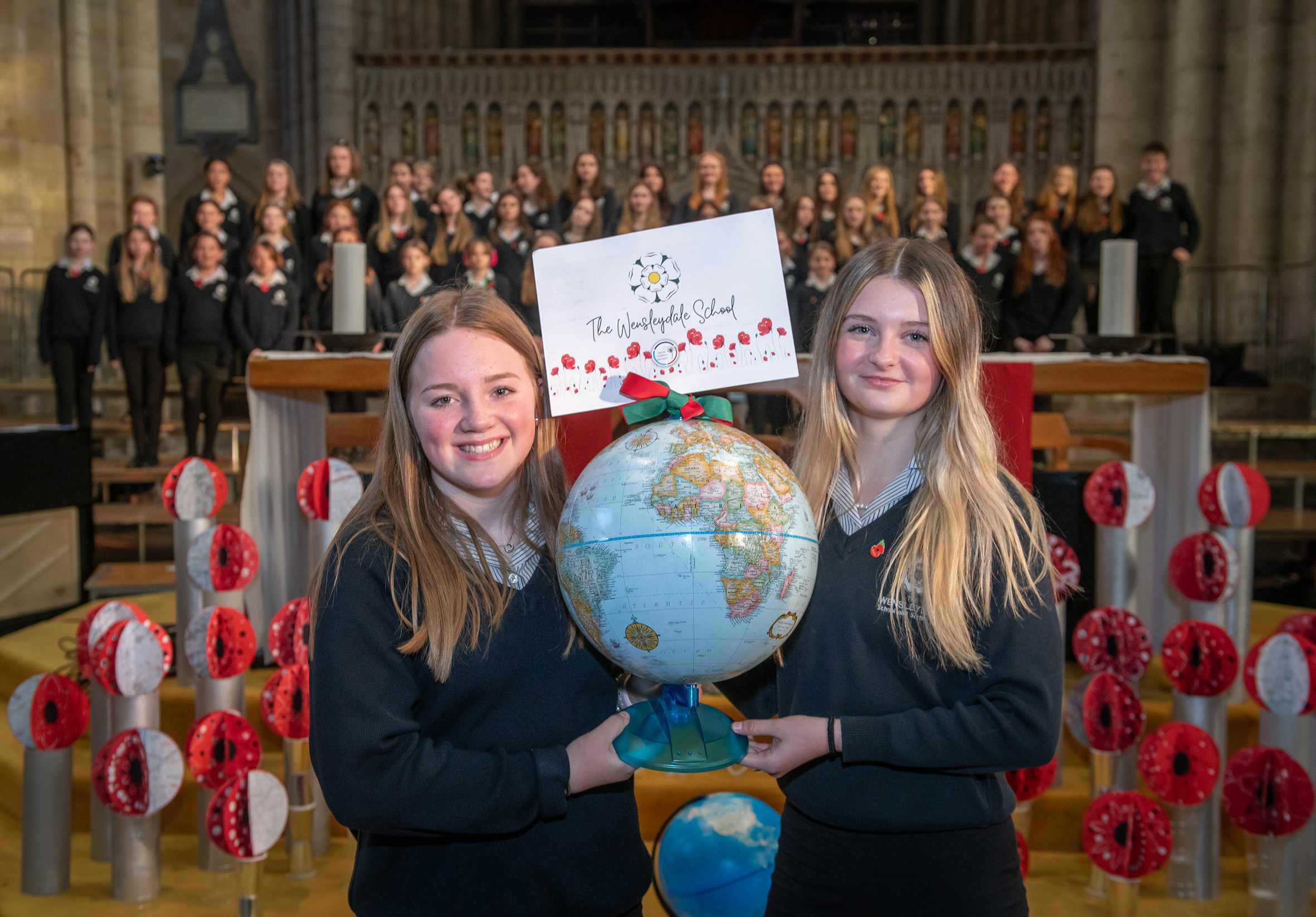 Wensleydale School students Millie Gilbey and Jessica Arnott with their school’s globe.