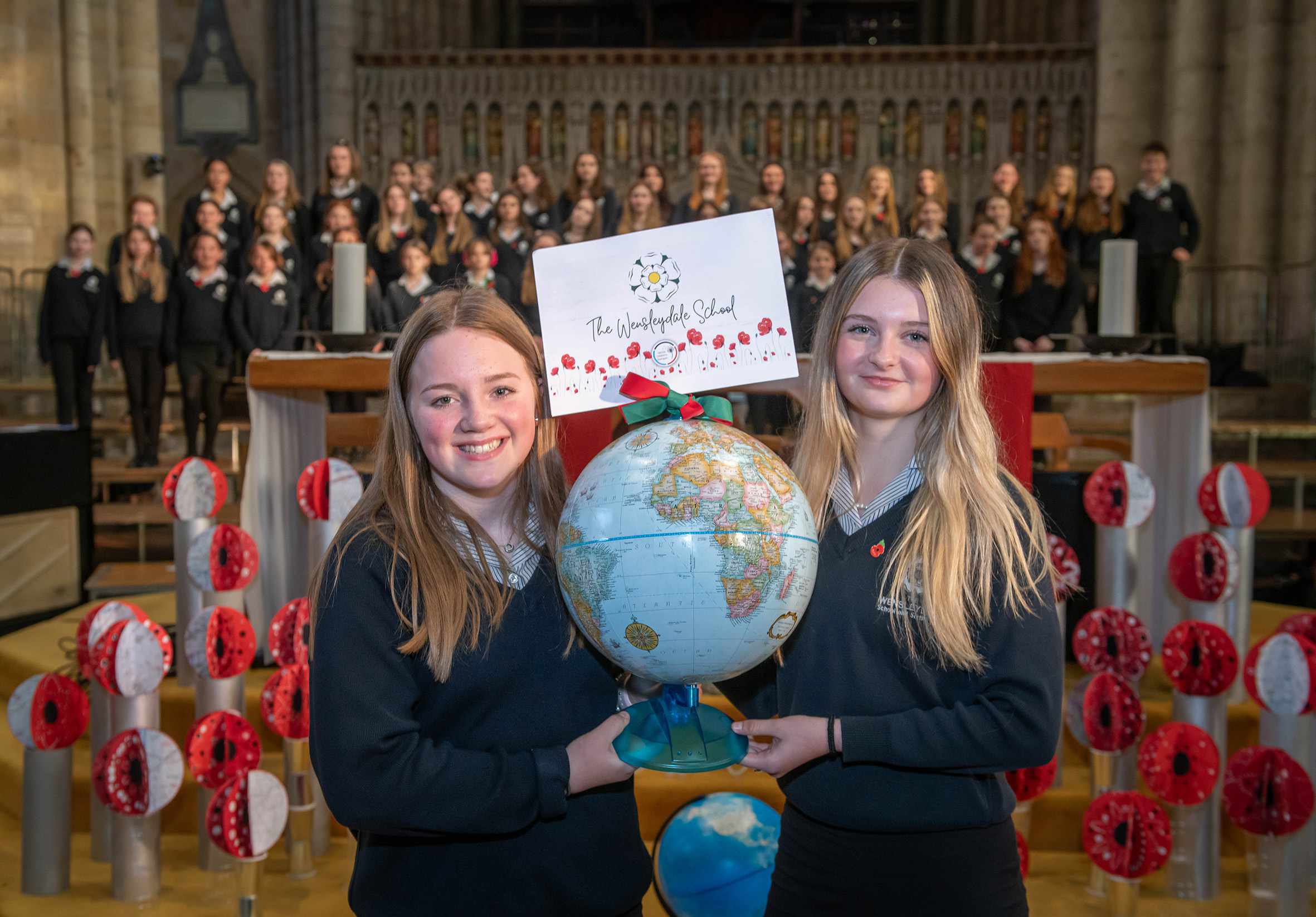 Wensleydale School students Millie Gilbey and Jessica Arnott with their school’s globe.