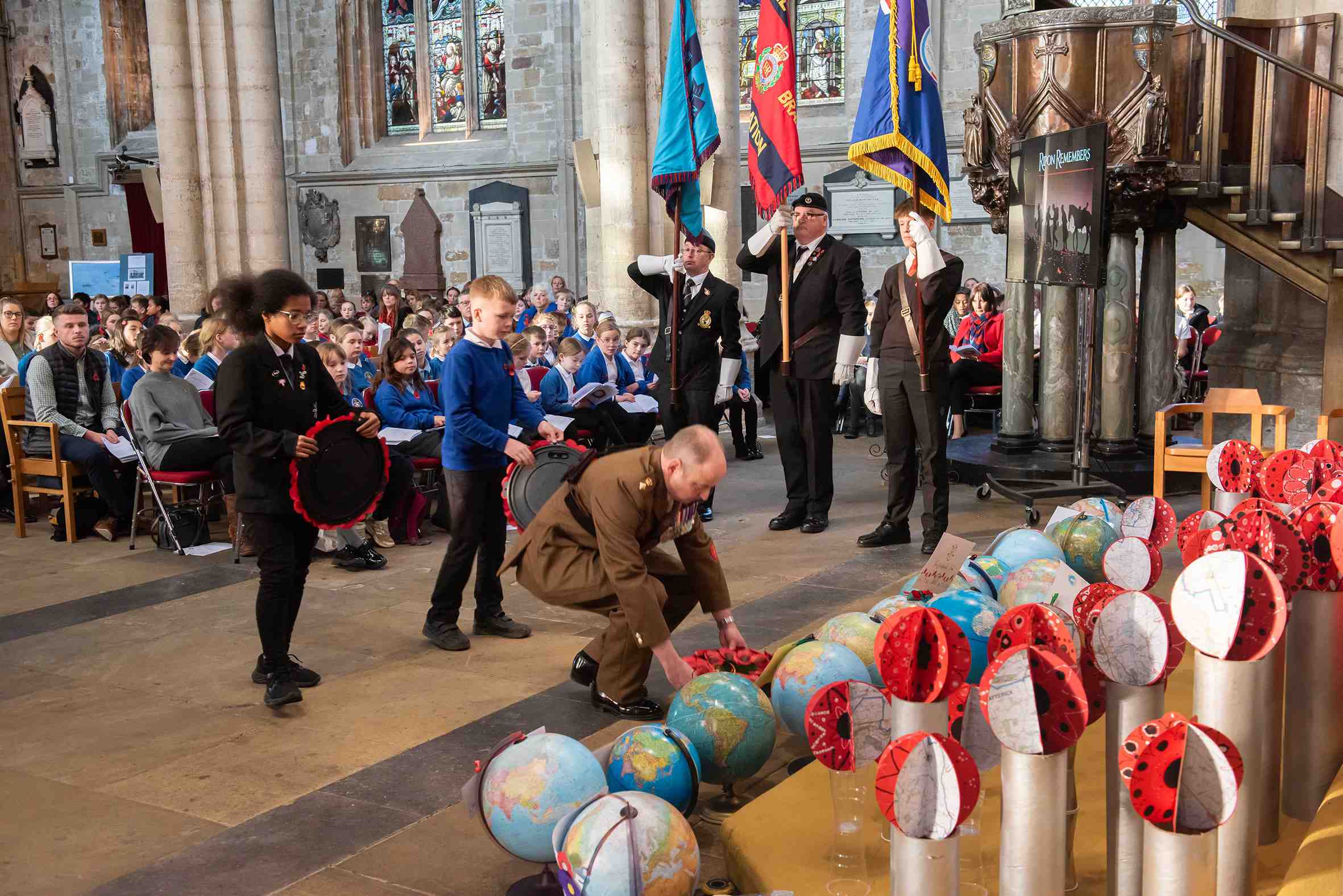 Childen from Wavell and Risedale schools lay wreaths with Catterick Garrison’s Commander, Lt Col Charlie Anderson