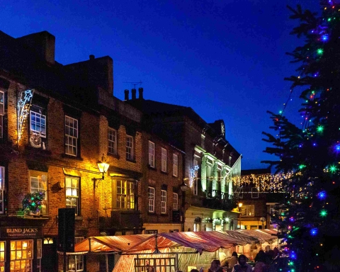 Knaresborough Christmas Market at night with Christmas twinkly lights by local photographer Charlotte Gale