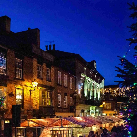 Knaresborough Christmas Market at night with Christmas twinkly lights by local photographer Charlotte Gale