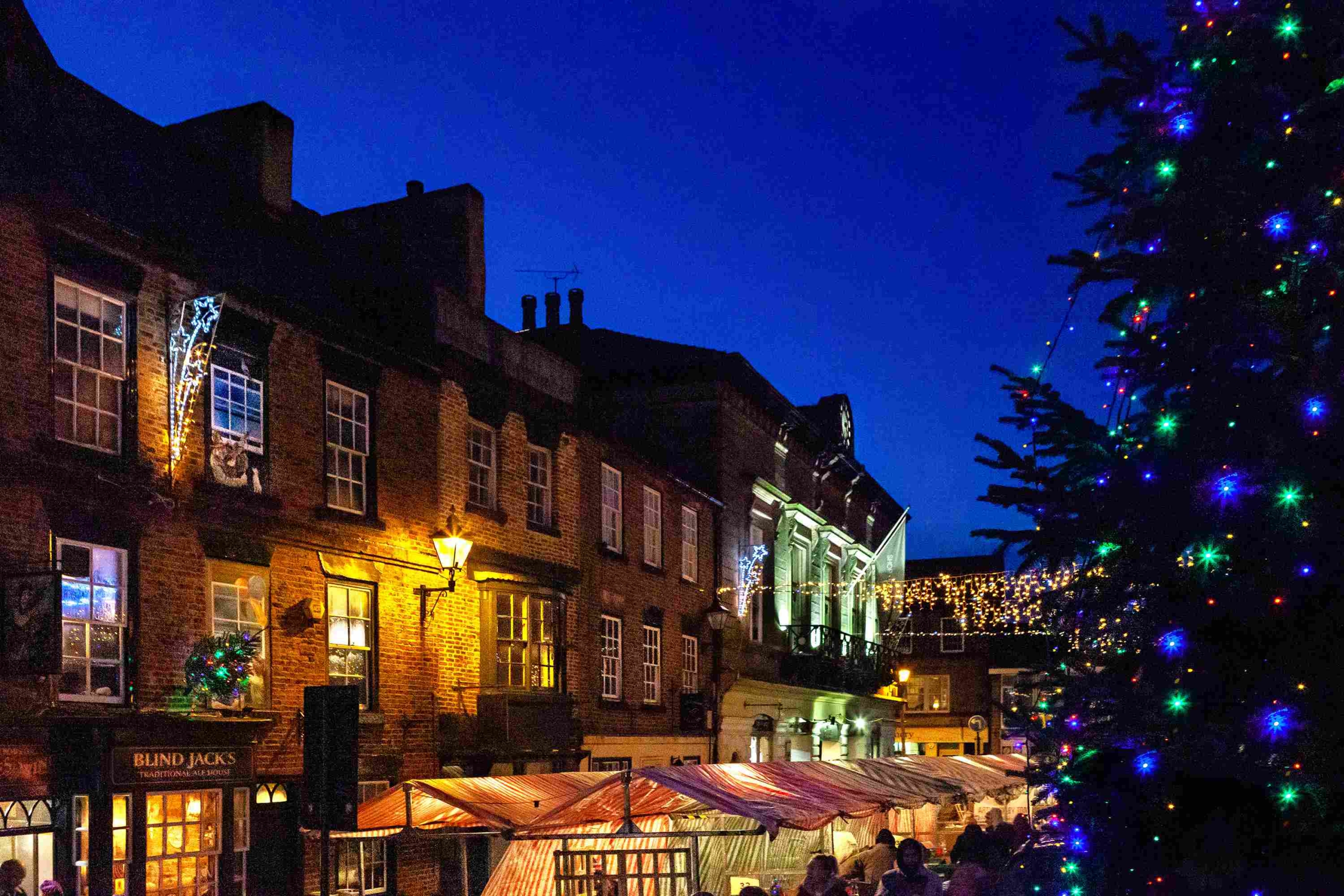 Knaresborough Christmas Market at night with Christmas twinkly lights by local photographer Charlotte Gale