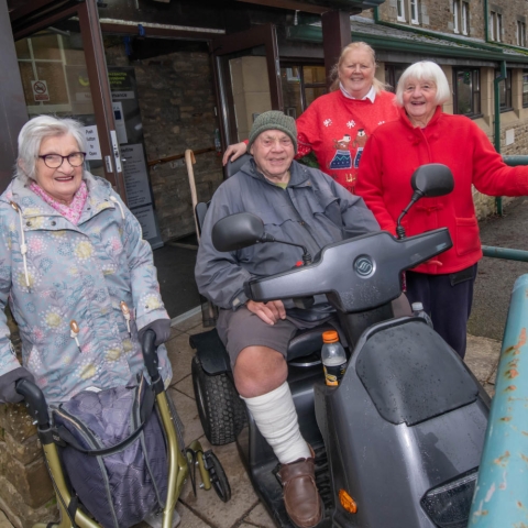 Rose Mary Baxter, Burke Smith, Hazel Drew and Jean Rowley outside the new accessible doors at Grassington Town Hall