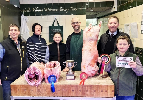CCM Skipton Christmas prime lamb younger handlers’ supreme champion, Oliver Marshall, right, with, from left, parents Rob and Sarah Marshall, brother Thomas, butcher Paul Kendall, and Skipton Auction Mart sales manager and auctioneer Ted Ogden. On the block are the two prize-winning prime lambs