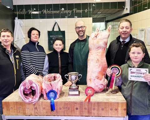 CCM Skipton Christmas prime lamb younger handlers’ supreme champion, Oliver Marshall, right, with, from left, parents Rob and Sarah Marshall, brother Thomas, butcher Paul Kendall, and Skipton Auction Mart sales manager and auctioneer Ted Ogden. On the block are the two prize-winning prime lambs
