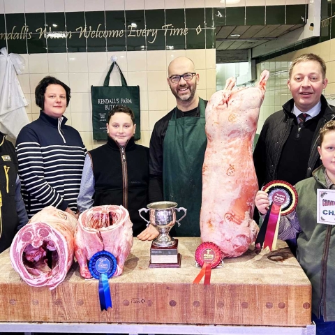 CCM Skipton Christmas prime lamb younger handlers’ supreme champion, Oliver Marshall, right, with, from left, parents Rob and Sarah Marshall, brother Thomas, butcher Paul Kendall, and Skipton Auction Mart sales manager and auctioneer Ted Ogden. On the block are the two prize-winning prime lambs