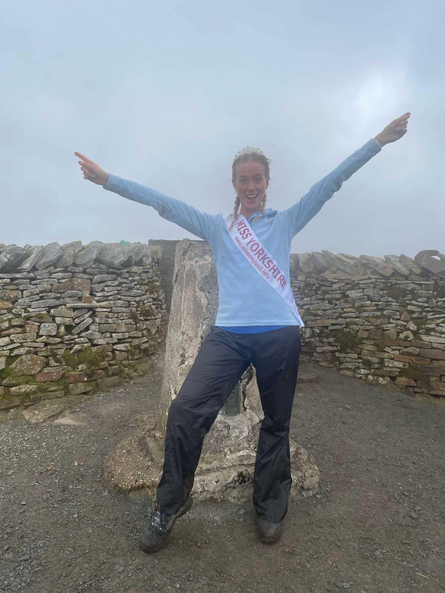 Miss Yorkshire winner Chloe McEwen celebrating one of the Three Peaks in her Miss Yorkshire sash and crown