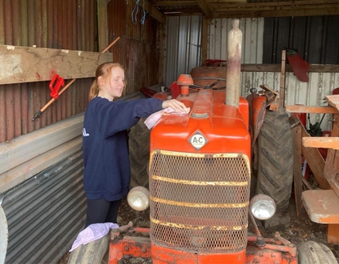Charlotte Wilson and her vintage Allis Chalmers tractor