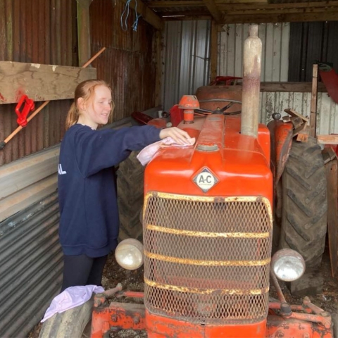 Charlotte Wilson and her vintage Allis Chalmers tractor