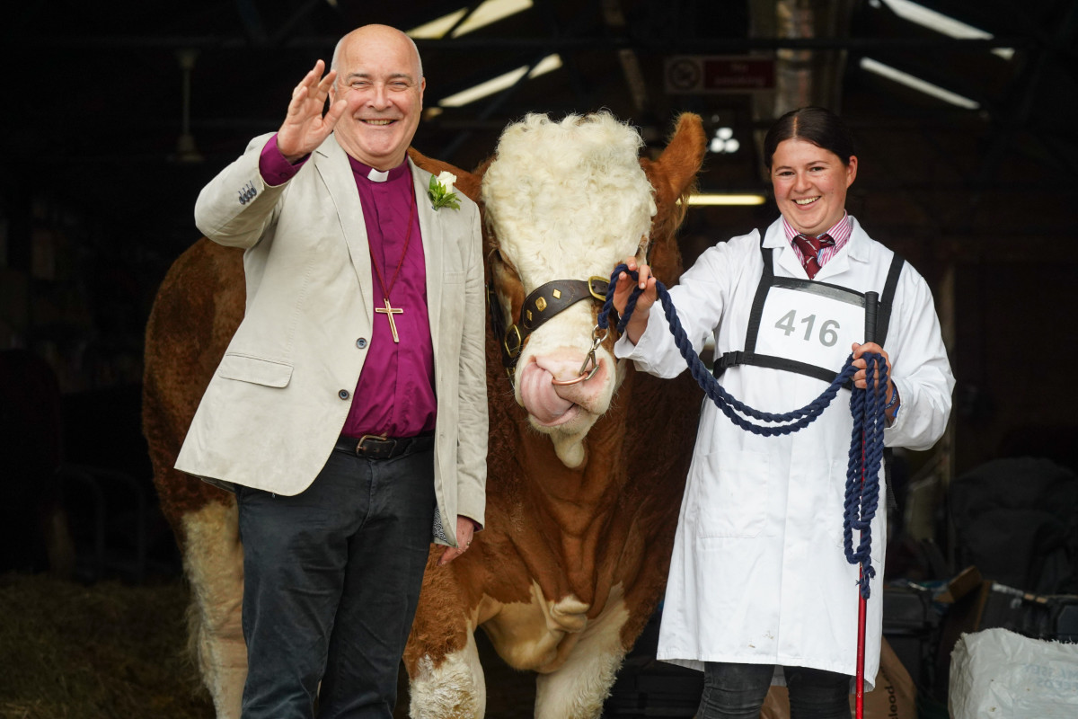 of York Stephen Cottrell blesses a Simmental - Fircovert Nigel, with its handler Holly Lutkin from Norwich at the Great Yorkshire Show_Wed